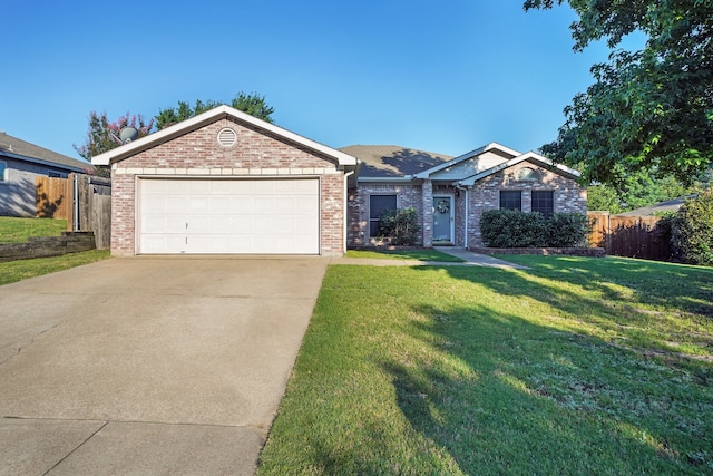 ranch-style house with a garage and a front yard