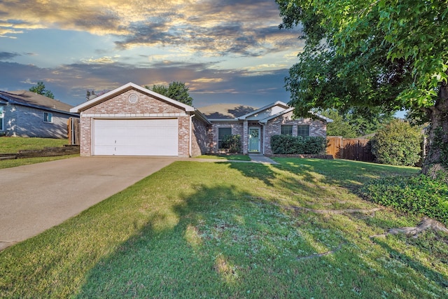 ranch-style home with a lawn