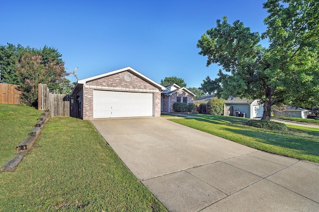 single story home featuring a front yard and a garage