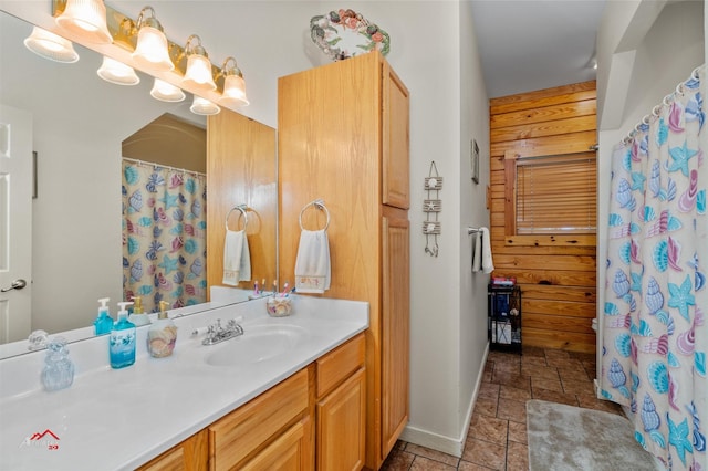 bathroom with wood walls and vanity