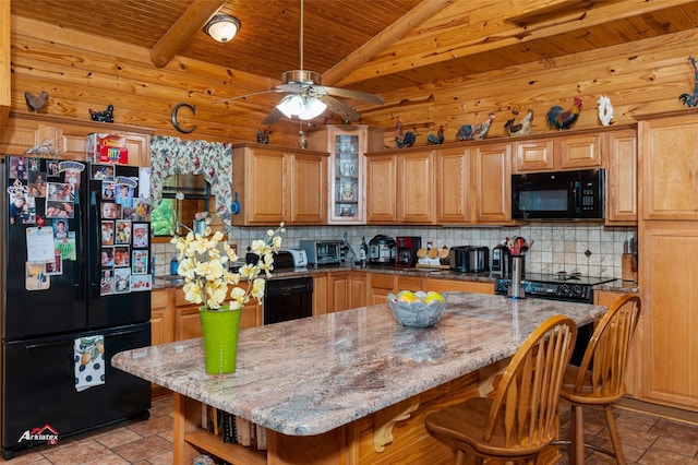 kitchen featuring black appliances, a center island, wood ceiling, and light stone counters