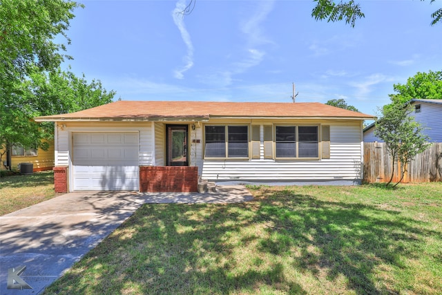 ranch-style home with a front lawn, a garage, and cooling unit