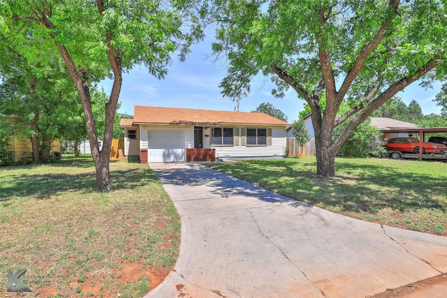 single story home featuring a front yard and a garage