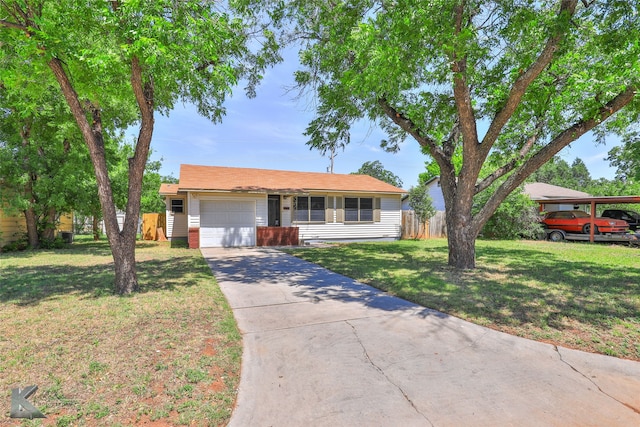 ranch-style home featuring a garage and a front lawn