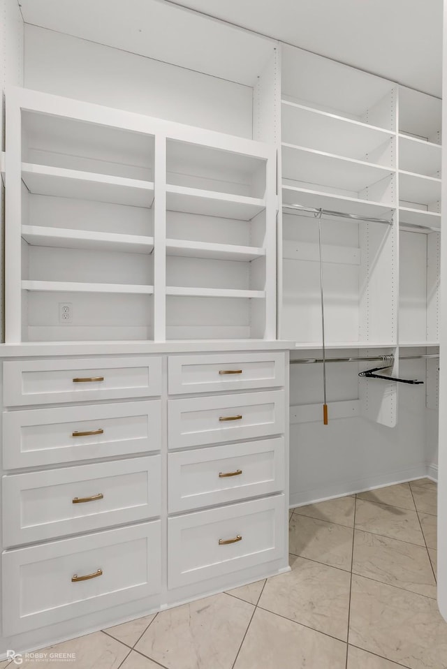 walk in closet featuring light tile patterned floors