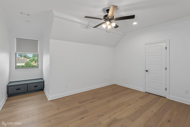 additional living space with ceiling fan, light hardwood / wood-style floors, and vaulted ceiling