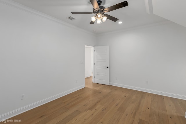 spare room with ceiling fan, ornamental molding, and light hardwood / wood-style floors