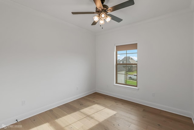 unfurnished room featuring light wood-type flooring, ceiling fan, and ornamental molding