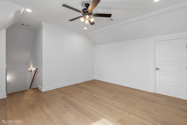 additional living space featuring ceiling fan, light hardwood / wood-style floors, and vaulted ceiling