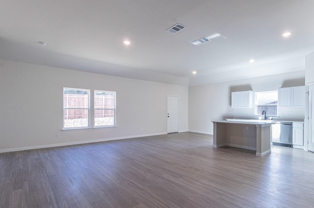 unfurnished living room with dark hardwood / wood-style floors