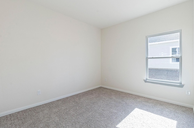 unfurnished room featuring carpet flooring