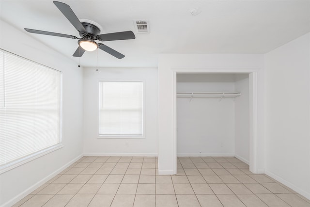 unfurnished bedroom with ceiling fan and light tile patterned floors