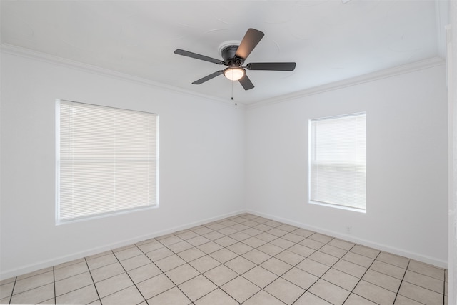 empty room with ceiling fan, crown molding, and light tile patterned floors