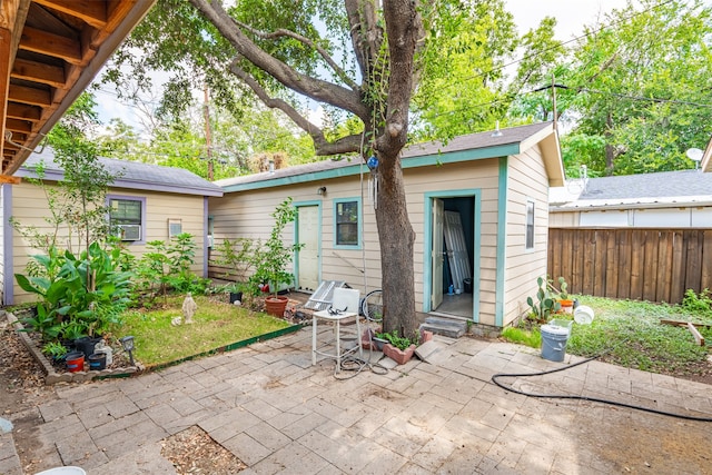 rear view of property featuring a patio