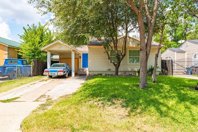 view of front facade with a carport and a front yard