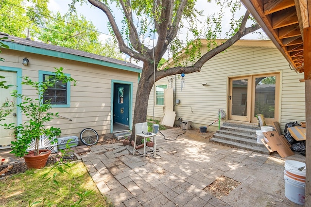 3912 Valentine St, Fort Worth, TX 76107 - rear view of house with a patio and entry steps
