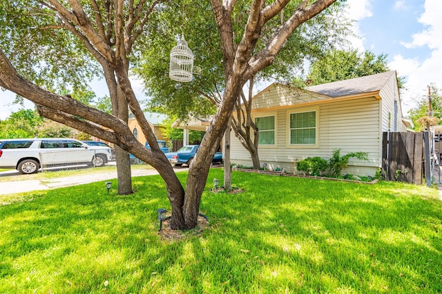 3912 Valentine St, Fort Worth, TX 76107 - view of front facade featuring a shingled roof, fence, and a front lawn