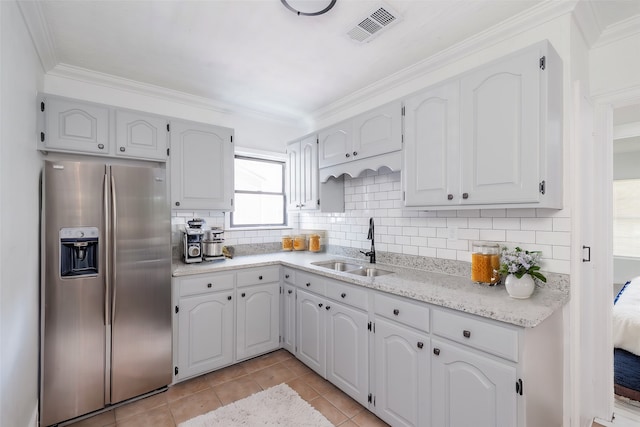 kitchen with crown molding, white cabinetry, sink, and stainless steel refrigerator with ice dispenser