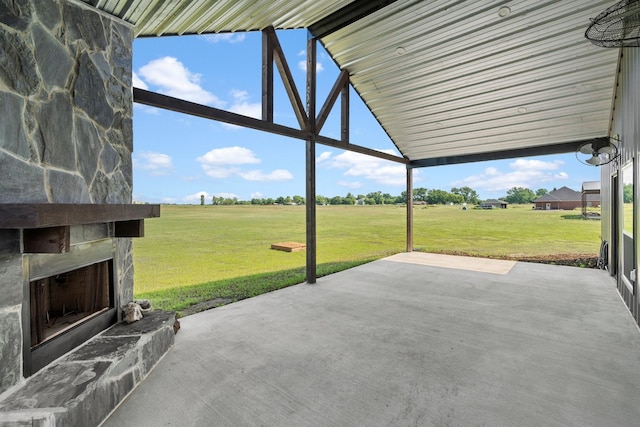 view of patio featuring an outdoor stone fireplace