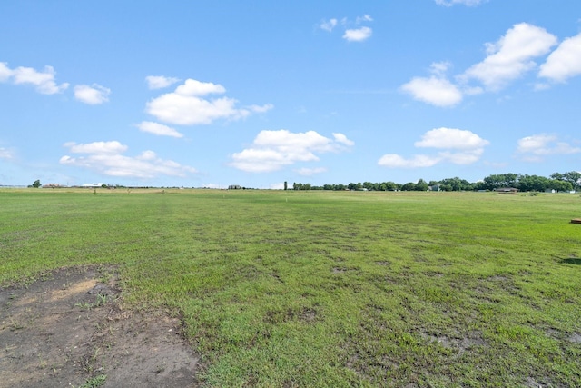 view of yard with a rural view