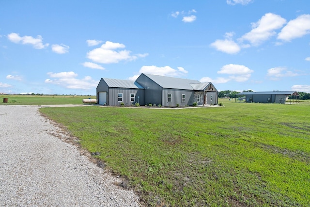 view of front of house featuring a garage and a front yard