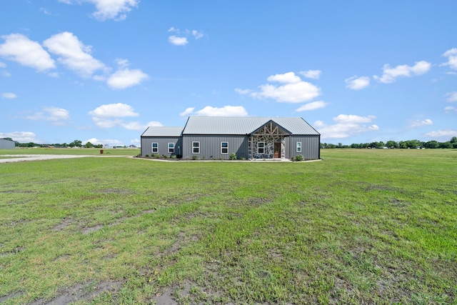 view of yard with a rural view and an outdoor structure