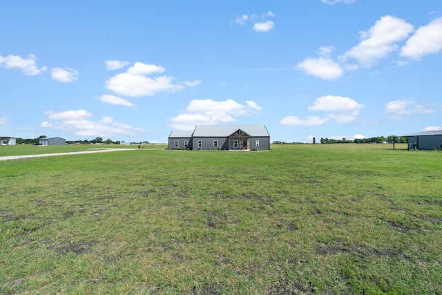 view of yard with a rural view