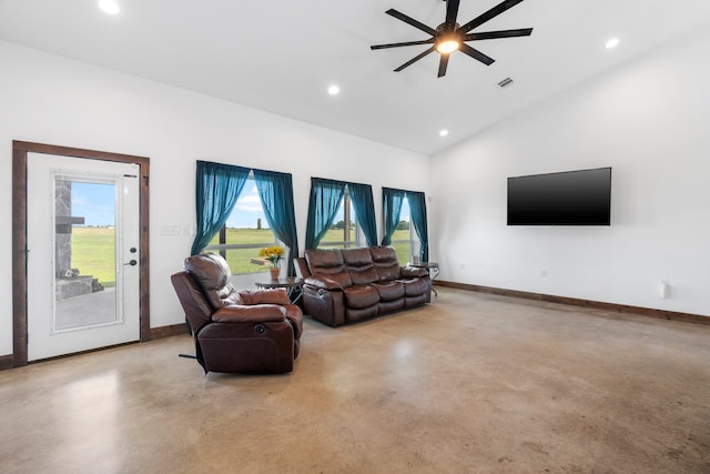 living room with ceiling fan, concrete flooring, and lofted ceiling