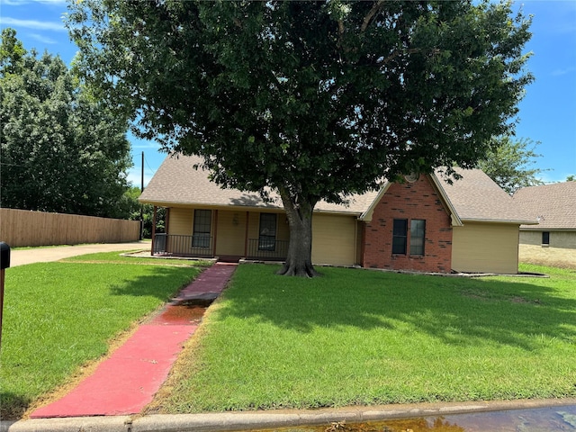 view of front facade featuring a front lawn and covered porch