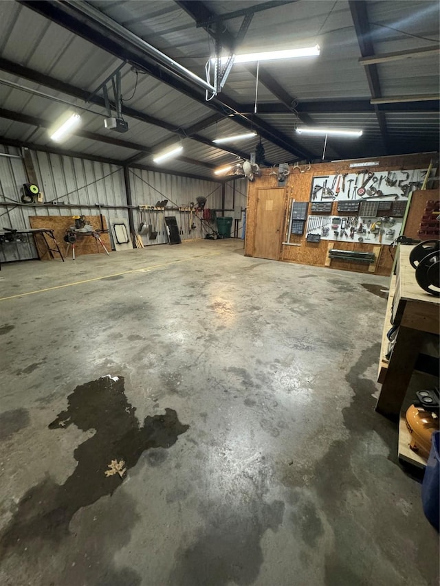 garage featuring a workshop area and a garage door opener