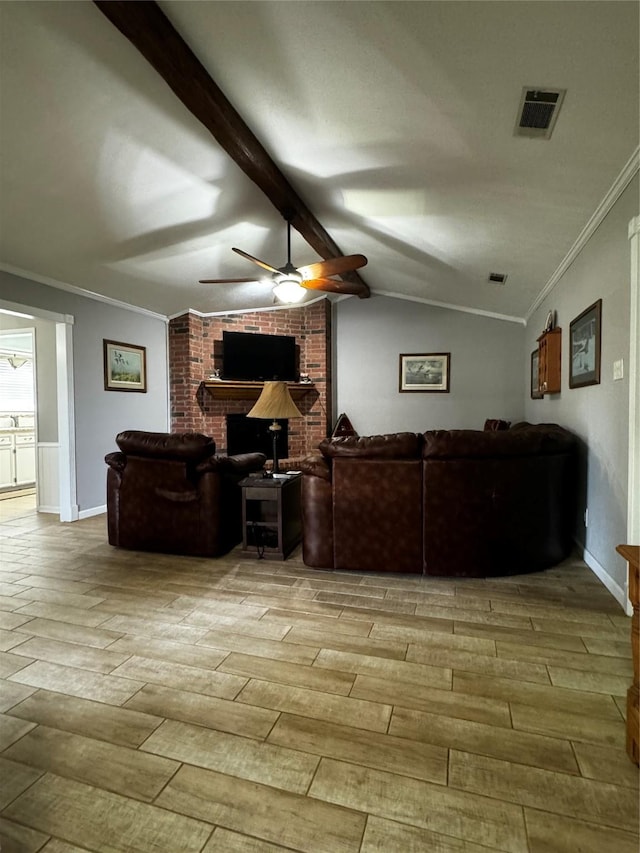 living room with vaulted ceiling with beams, crown molding, and light wood-type flooring