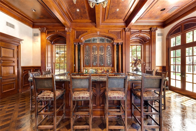 bar featuring french doors, crown molding, and a wealth of natural light