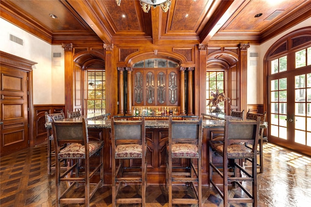 bar featuring french doors, wood ceiling, crown molding, and dark parquet floors