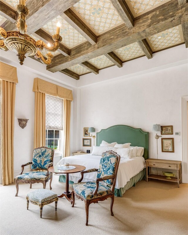 bedroom featuring ceiling fan, carpet flooring, and beam ceiling