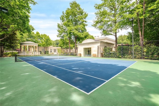 view of tennis court featuring a gazebo