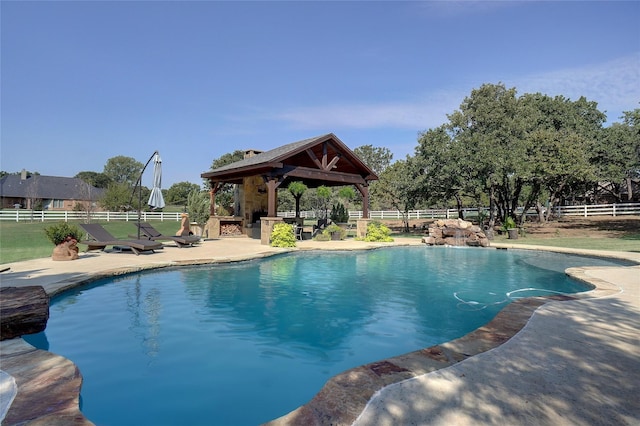 view of swimming pool with a gazebo and a patio area