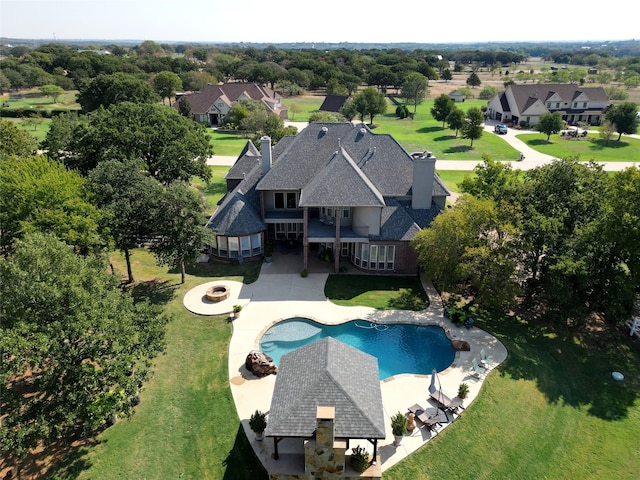 view of swimming pool with a patio, a gazebo, a yard, and an outdoor fire pit