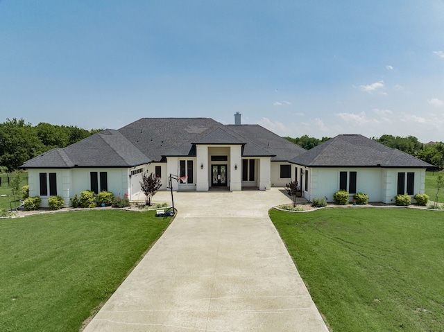 prairie-style house featuring a front lawn