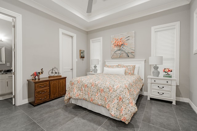 tiled bedroom with connected bathroom and ceiling fan