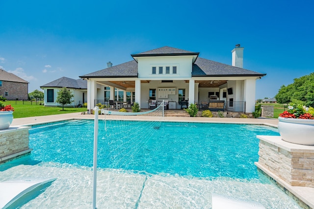 view of pool featuring outdoor lounge area and a patio