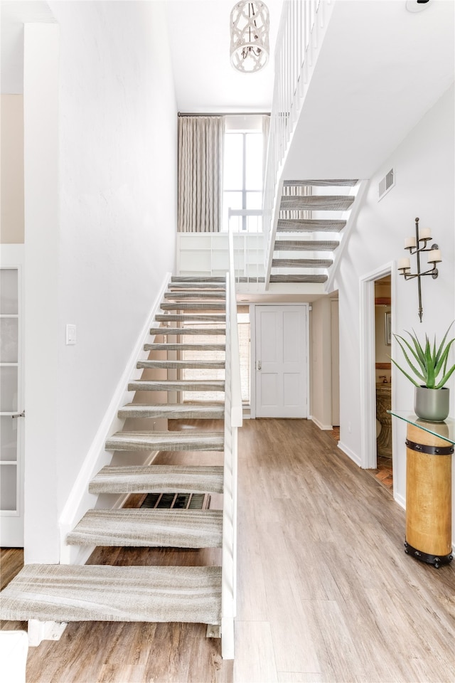 stairway with wood-type flooring