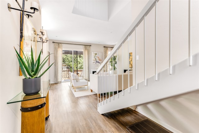 interior space with a chandelier and wood-type flooring