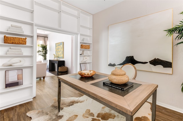 home office with wood-type flooring