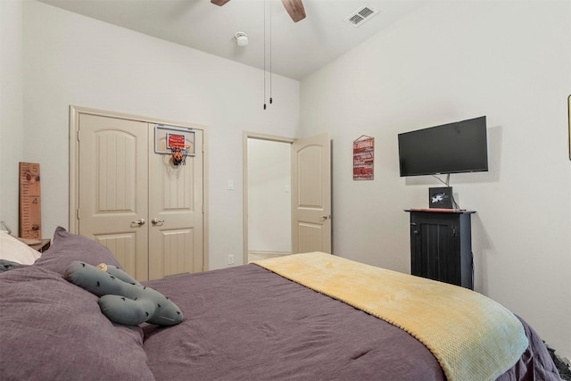 bedroom with a closet, visible vents, and a ceiling fan