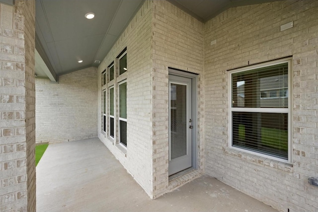 entrance to property with brick siding