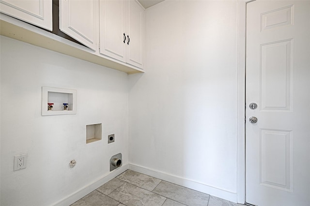 washroom featuring hookup for a washing machine, light tile patterned flooring, cabinets, and hookup for an electric dryer