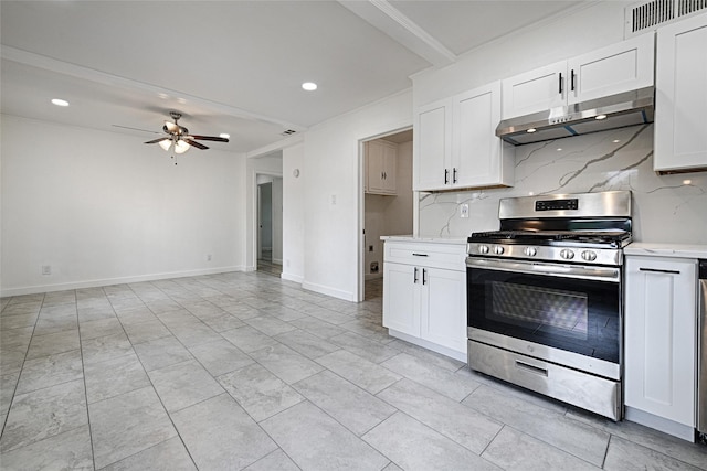 kitchen featuring decorative backsplash, white cabinetry, and stainless steel stove