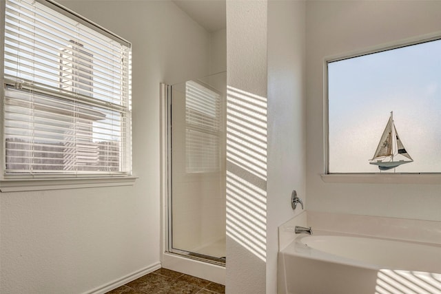 bathroom featuring separate shower and tub and tile patterned flooring