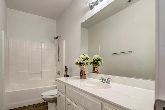 full bathroom with tile patterned floors, vanity, shower / bath combination, and toilet