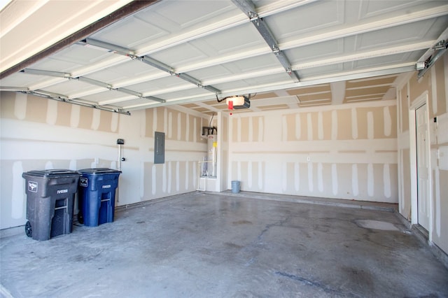 garage featuring electric panel, water heater, and a garage door opener